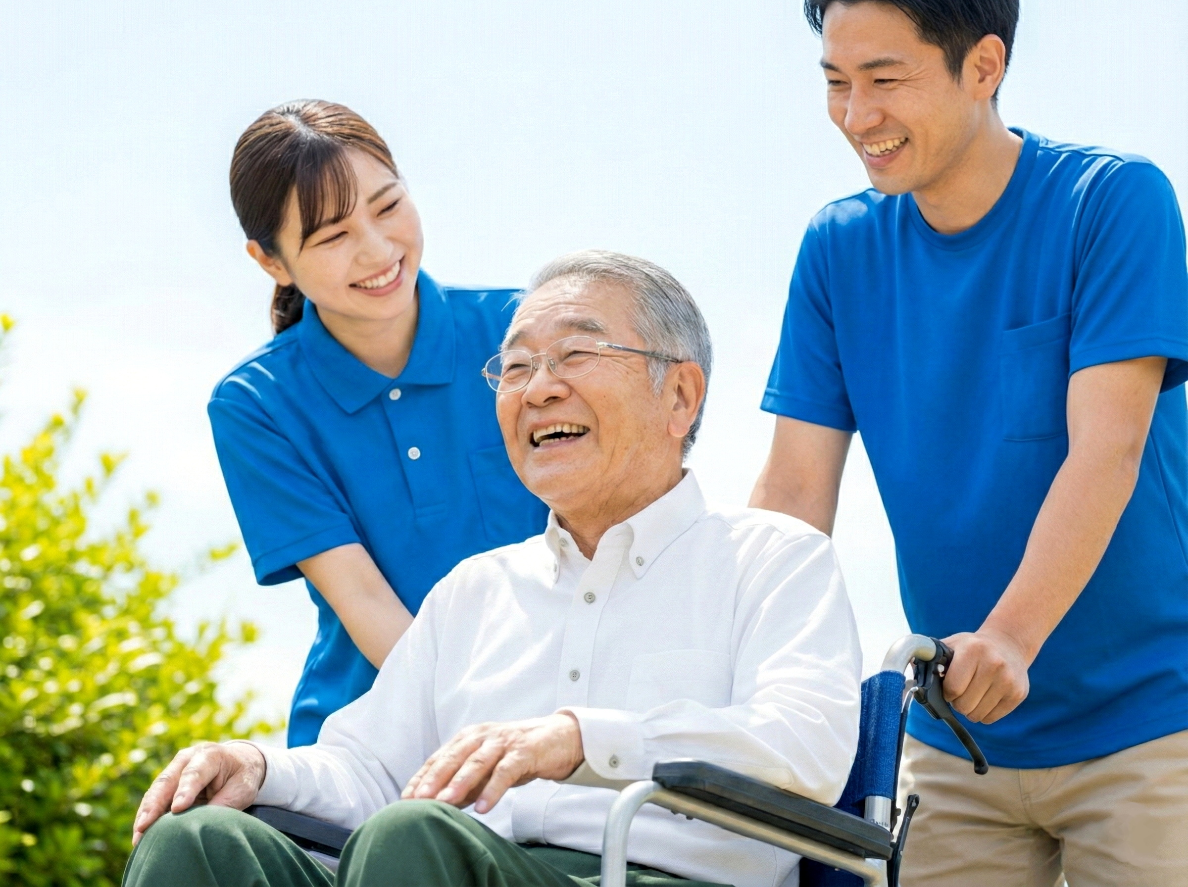 Smiling staff assisting elderly